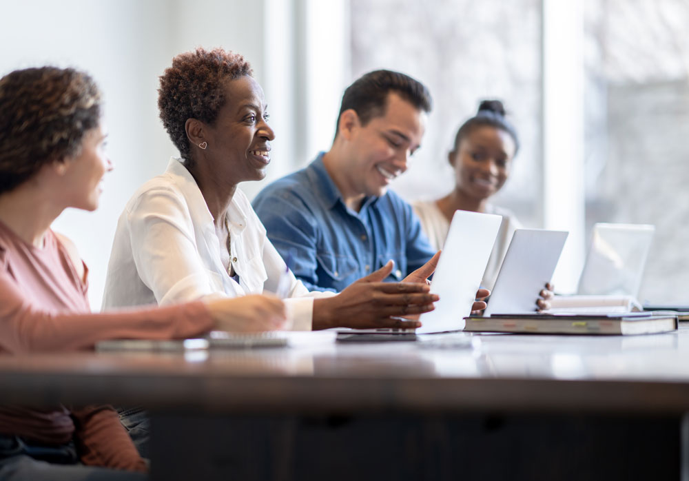 Adults learning together in a bright classroom