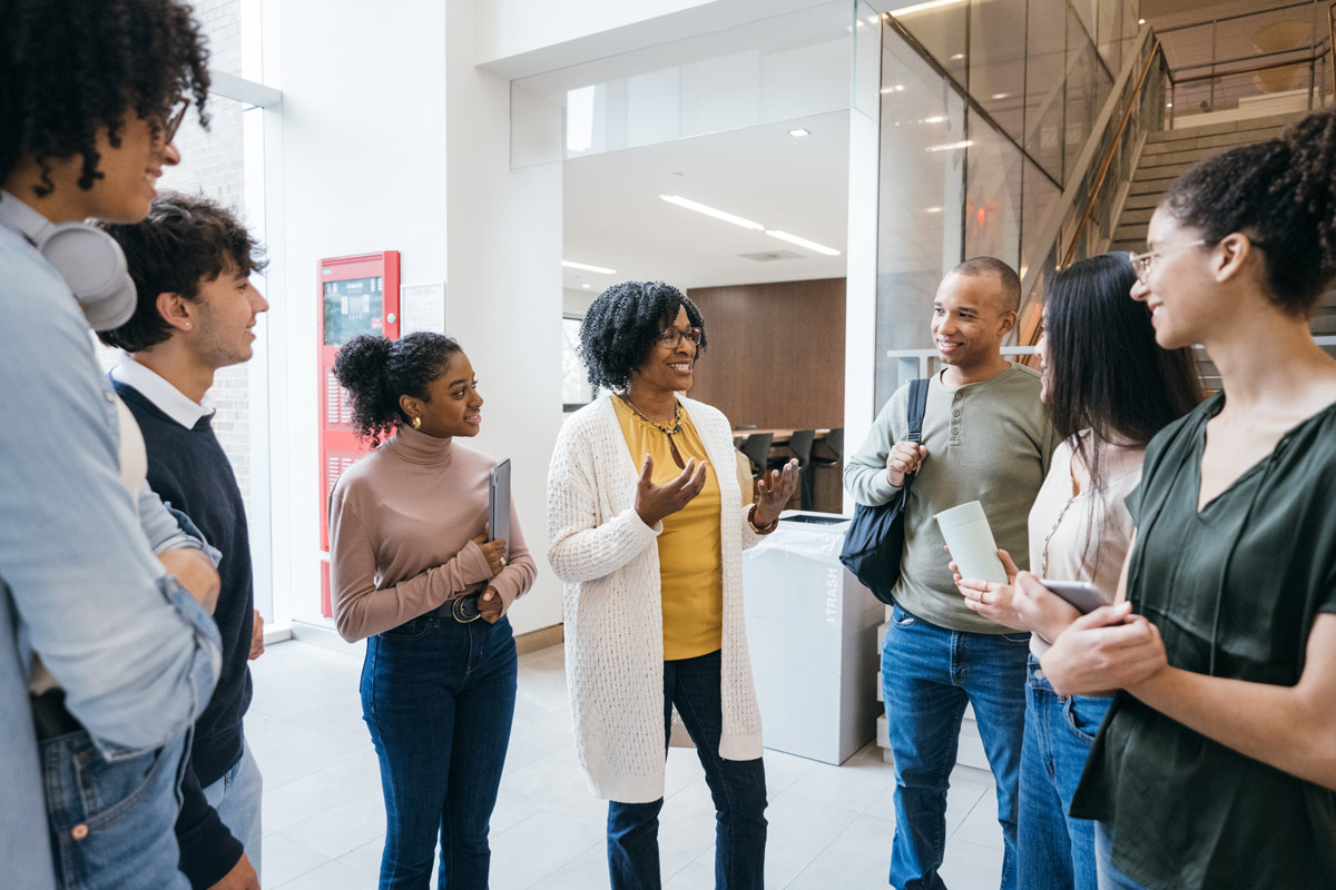 Diverse group engaged in conversation indoors