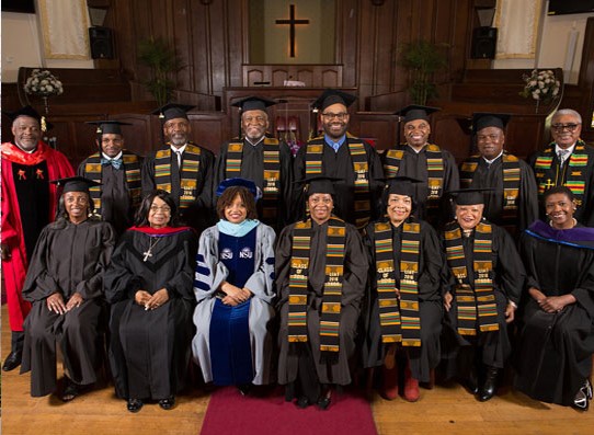 LIAT program graduates seated together in caps and gowns